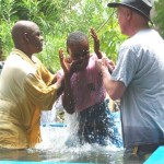 Dean baptizing with water from the first CrossWay International Well